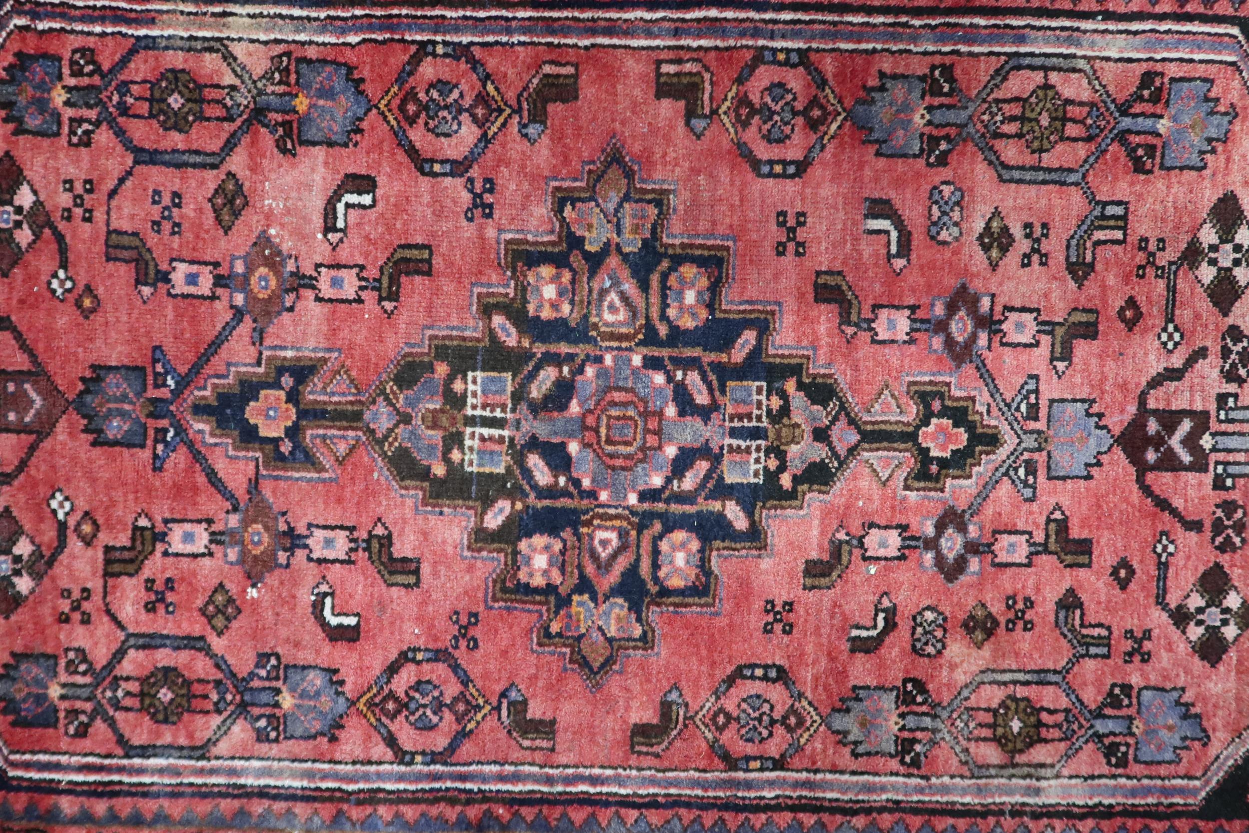 A red ground Hamadan runner with dark central medallion, matching spandrels on floral pattern - Image 2 of 4