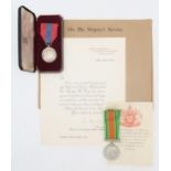 A cased George VI Imperial Service Medal awarded to George Bertie Smith, with accompanying letter