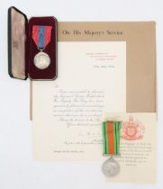 A cased George VI Imperial Service Medal awarded to George Bertie Smith, with accompanying letter