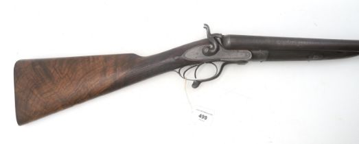 A 12 bore double-barrelled shotgun with lock plates engraved Army & Navy C.S.L., having a nicely
