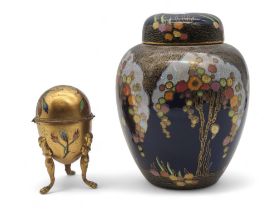 A large Crown Devon ginger jar and cover together with an antique gilded and enamelled egg shaped
