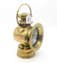 A brass Lucas "King of the Road" automotive lamp, no. 724, measuring approx. 25.5cm in height,