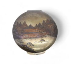 A Japanese silver niello compact, the lid decorated with a landscape scene, 8cm diameter, 80gms