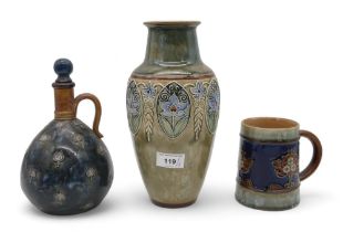 A collection of Royal Doulton glazed stoneware including a mug, a vase, and a decanter Condition