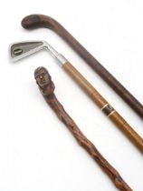 A thornwood folk art walking stick, with handle with pommel carved as the head of Robert Burns, a "