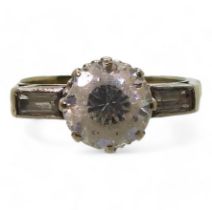 A yellow metal and platinum cz three stone ring, size L1/2, weight 3.7gms Condition Report:Available