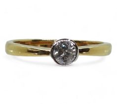 An 18ct yellow and white gold solitaire diamond ring, set with an estimated approx 0.30ct
