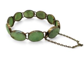 A green hardstone bracelet mounted in white metal Condition Report:No condition report available.
