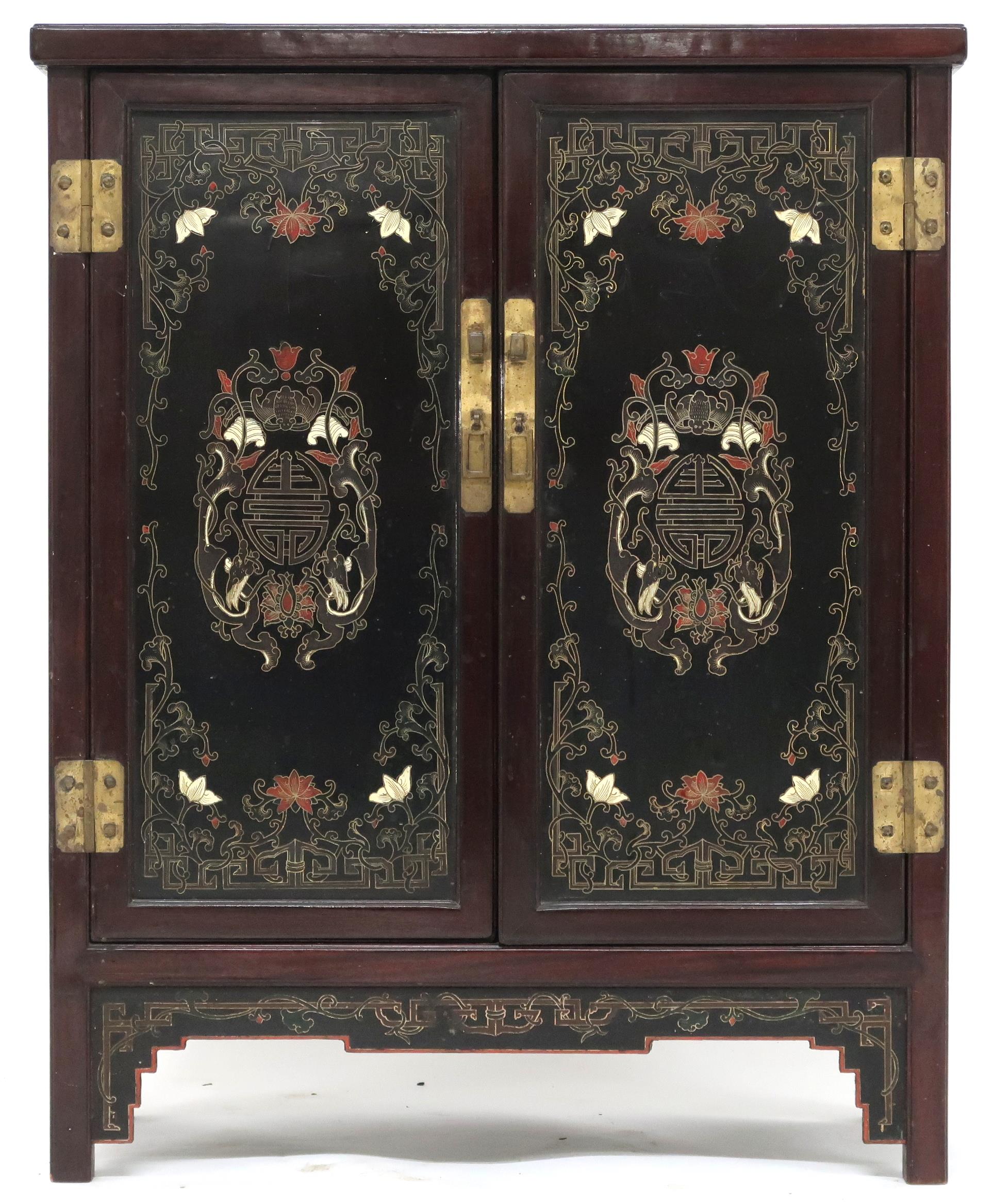 A 20th century Chinese hardwood two door side cabinet with lacquered panel top, sides and doors