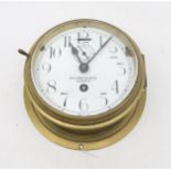 A ship's brass bulkhead clock by John Morton & Co., Glasgow Condition Report:Available upon request