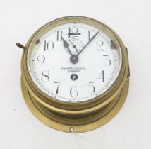 A ship's brass bulkhead clock by John Morton & Co., Glasgow Condition Report:Available upon request
