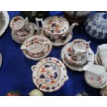 An early 19th century imari pattern teaset comprising teapot, cups, saucers, jug, sugar pot, bowl