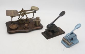 A lot comprising two desk embossers and a set of  postal scales
