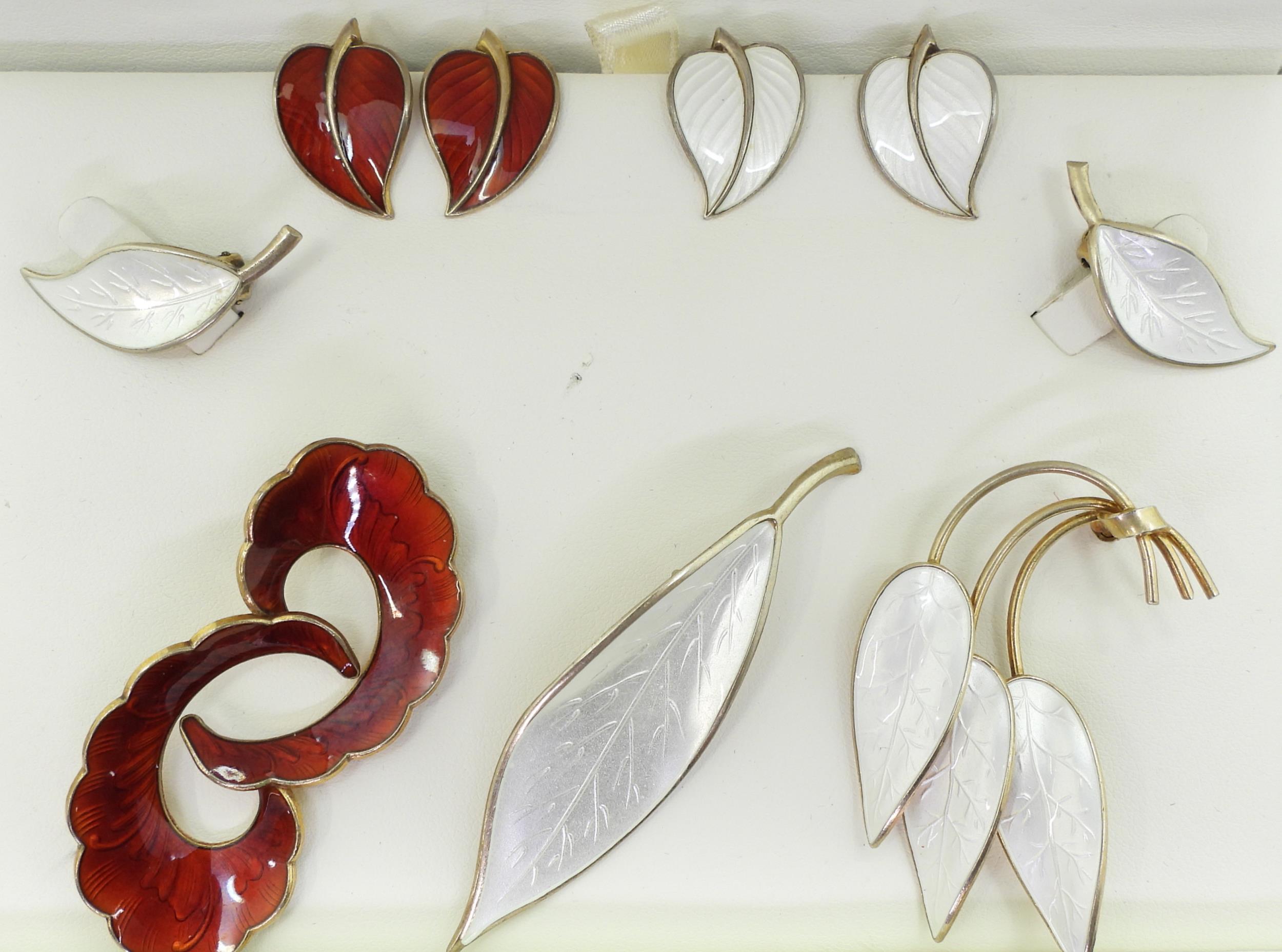 A collection of silver gilt  Norwegian enamel jewellery to include a white leaf brooch and - Image 2 of 6