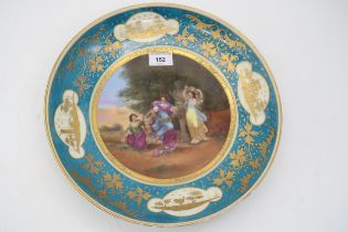 A Vienna porcelain dish transfer printed and overpainted with a scenes of maidens, signed Reynolds