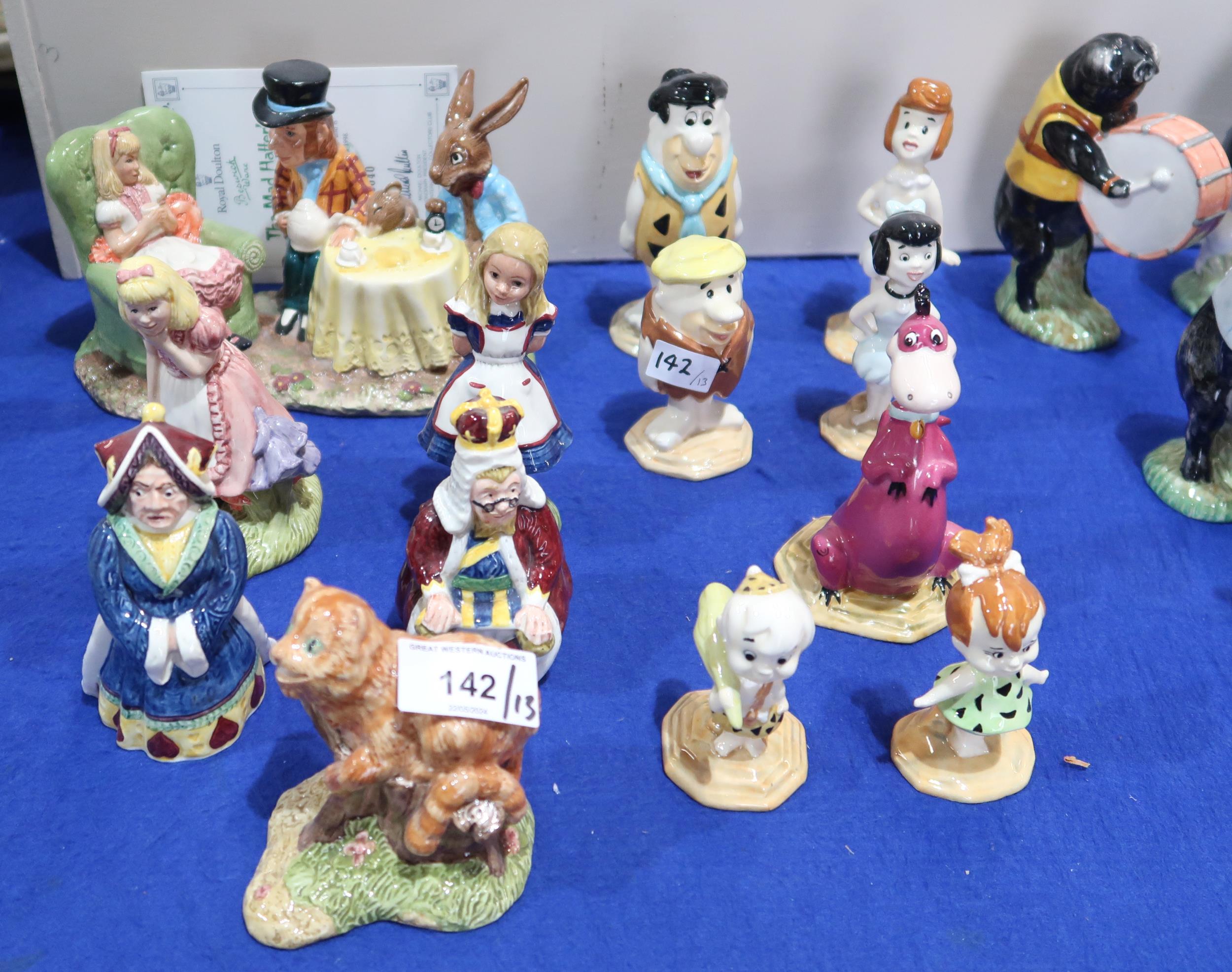 A collection of Beswick figures including Mad Hatters Tea Party with certificate, five other Alice