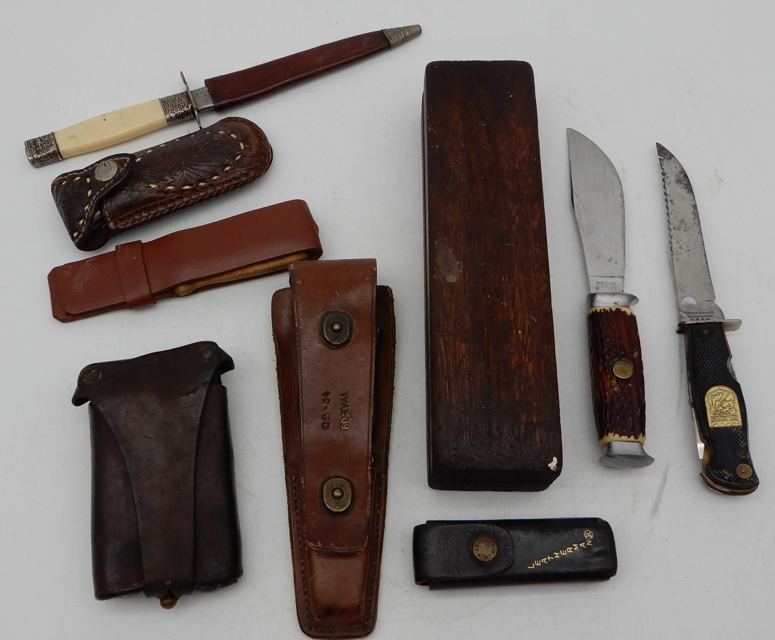 A lot comprising a Leatherman, Gerber multi tool, wood knives and a sharpening stone etc Condition