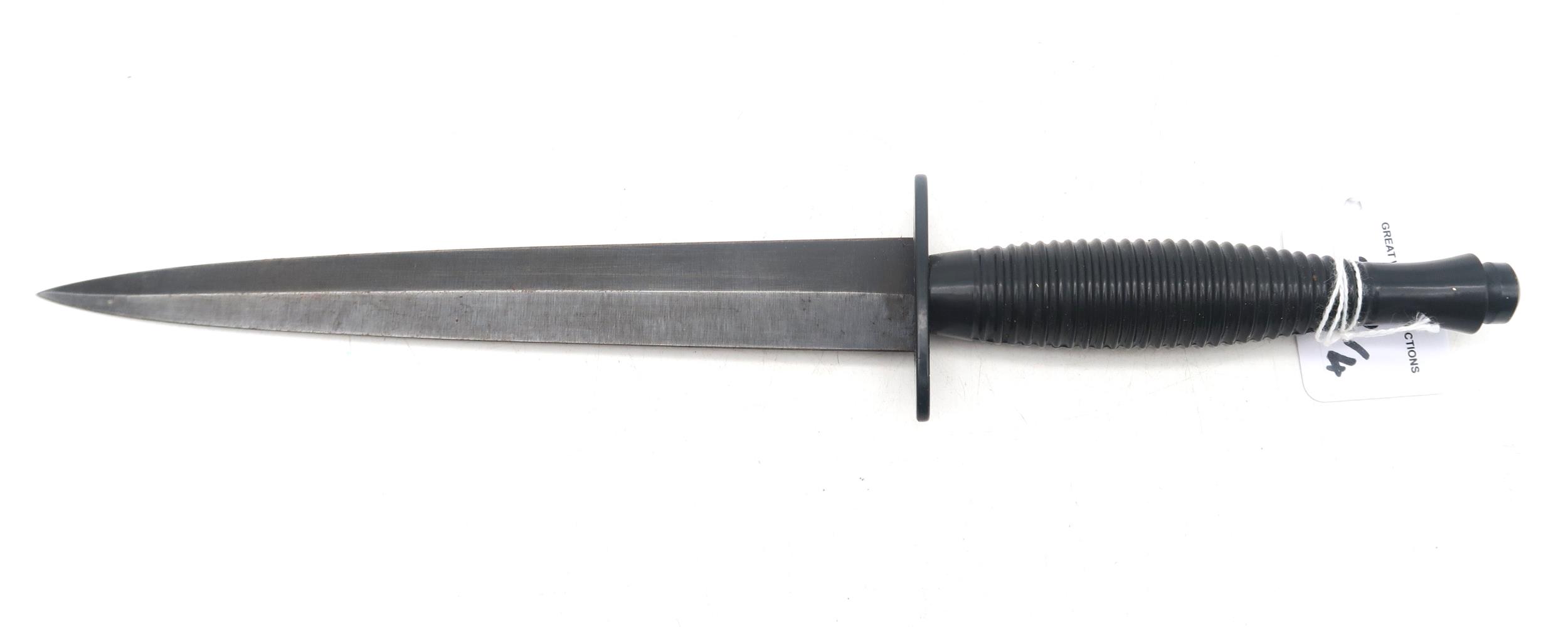 A Fairbairn Sykes Third Pattern fighting knife, with black grip; together with a weighted cosh, - Image 2 of 2