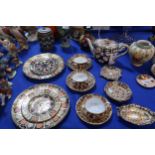 A collection of Royal Crown Derby imari pattern teawares including two plates, two side plates,