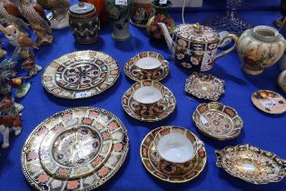 A collection of Royal Crown Derby imari pattern teawares including two plates, two side plates,