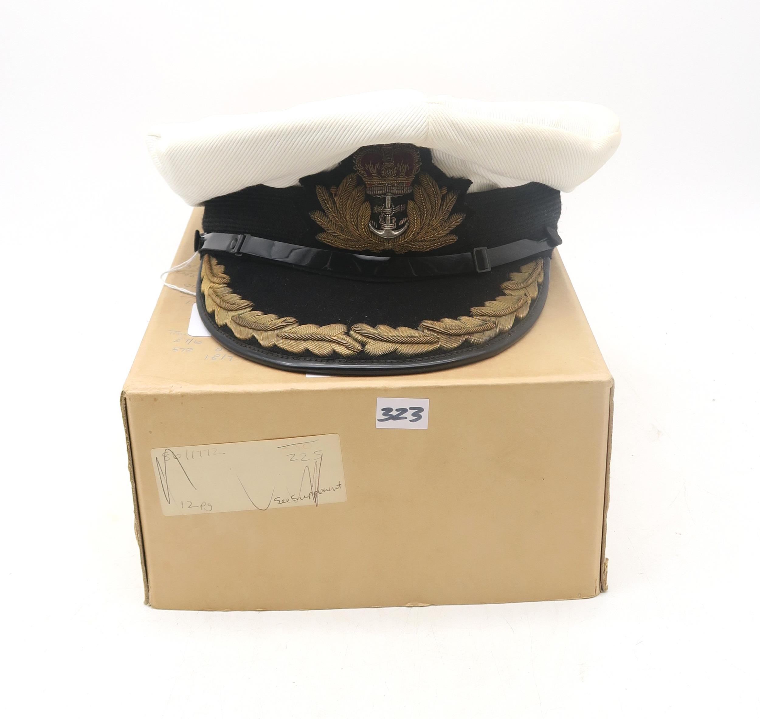 A post-War Royal Navy officer's cap by Gieves Ltd. of London, with bullion oak leaf embroidery to