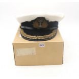A post-War Royal Navy officer's cap by Gieves Ltd. of London, with bullion oak leaf embroidery to