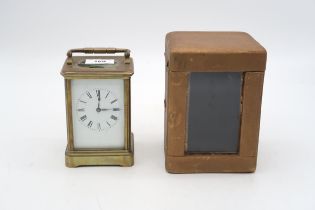 A French brass and glass carriage clock with travel case Condition Report:Available upon request
