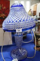 A blue flashed and cut glass table lamp and shade Condition Report:Available upon request