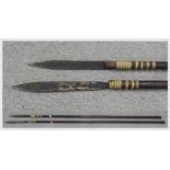 Two large Bornean Dayak-type blowpipe spears, the hardwood shafts with flared butt ends (2) Conditio