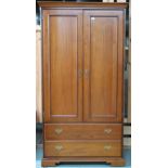 A contemporary Younger two door wardrobe with moulded cornice over pair of doors over two long