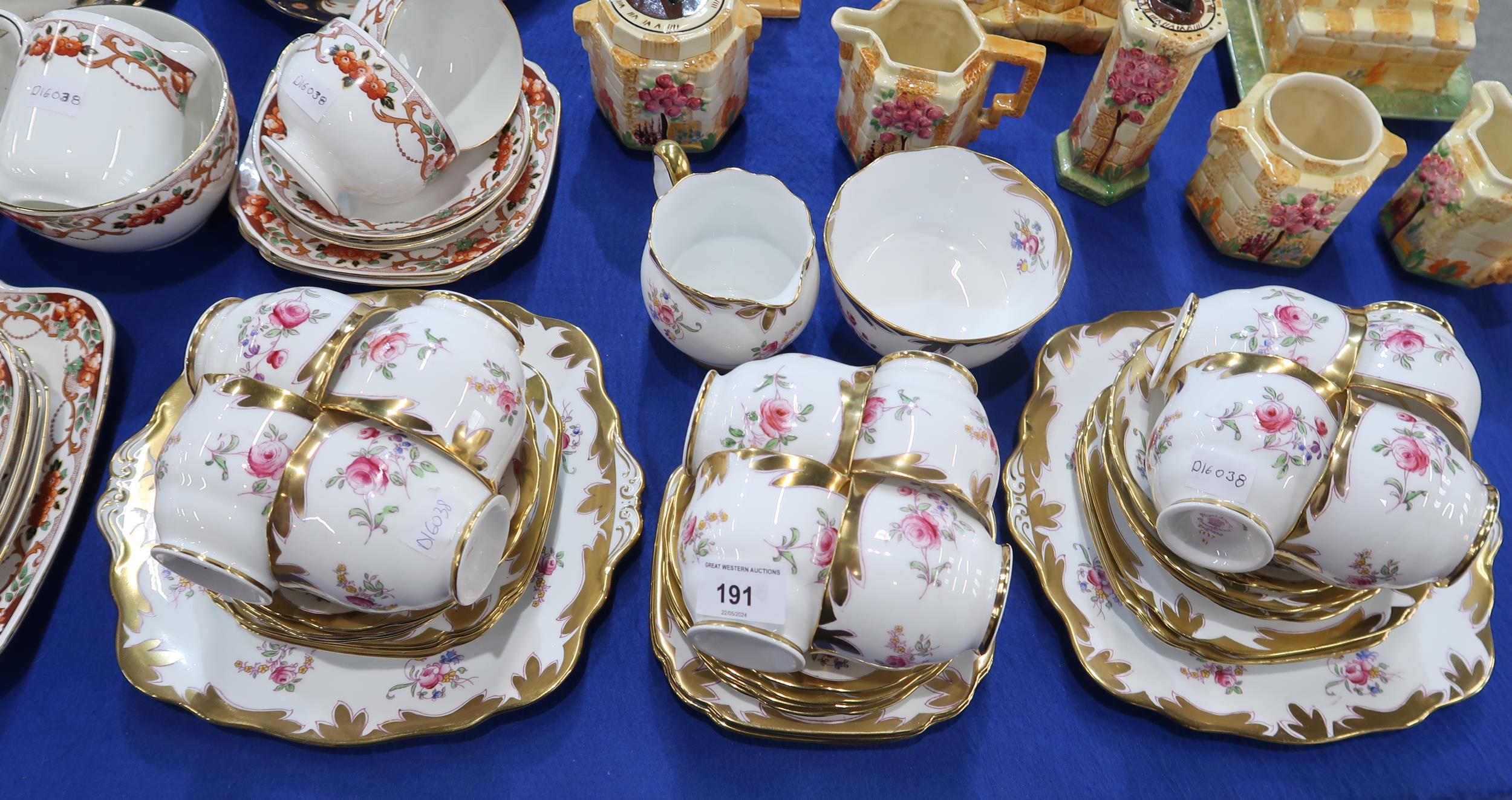 A Royal Albert teaset transfer printed and overpainted with roses, together with Duchess,
