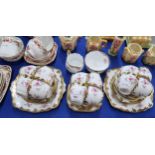 A Royal Albert teaset transfer printed and overpainted with roses, together with Duchess,