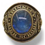 A 10k gold Balfour brand American college ring, set with a blue gem, for Brinkley High School