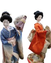 Two Japanese geisha dolls, one holding a parasol, the other a branch, 43 and 45cm high Condition