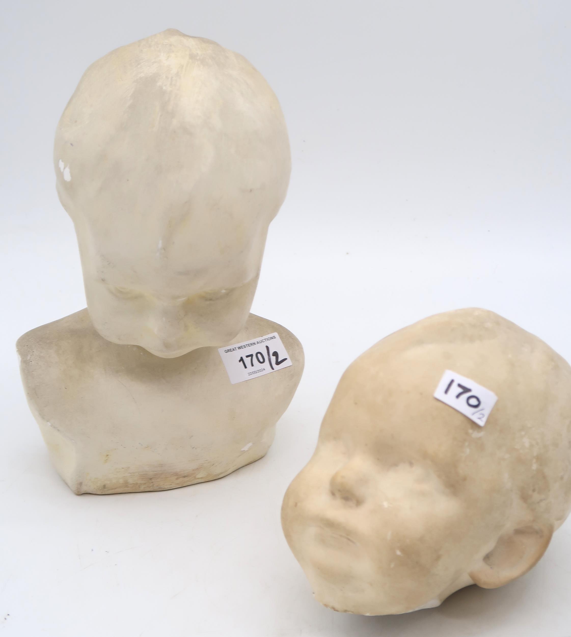 A plaster head of a baby and another  Condition Report:Available upon request