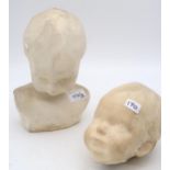 A plaster head of a baby and another  Condition Report:Available upon request