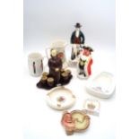 A collection of advertising figures and ashtrays including Canada Dry Ginger Ale, Catto's scotch