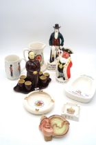 A collection of advertising figures and ashtrays including Canada Dry Ginger Ale, Catto's scotch