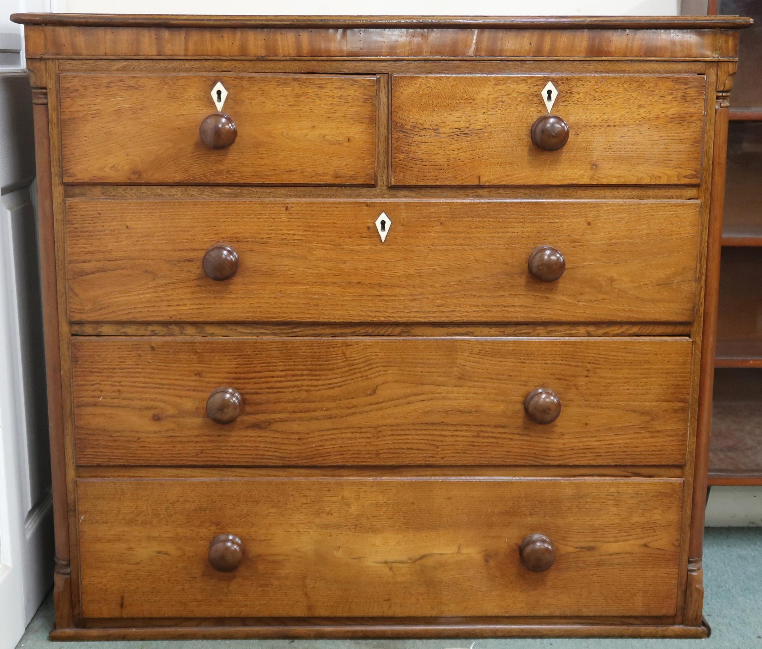 A 19th century oak two over three chest on chest top with moulded cornice over drawers with turned