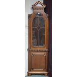 A 20th century reproduction corner display cabinet with architectural style dentil cornice over