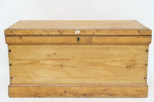 A late Victorian pine blanket chest with iron carry handles on plinth base, 62cm high x 125cm wide x