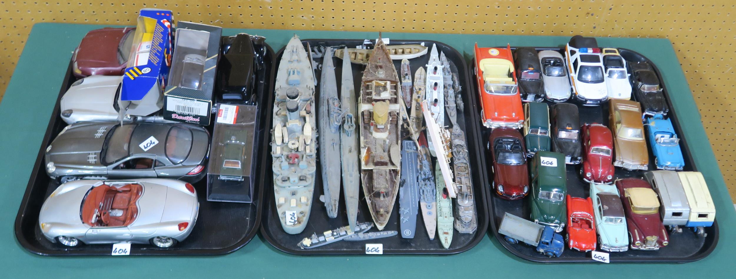A mixed assortment of model vehicles and craft, including examples by Maisto, Burago, the Franklin
