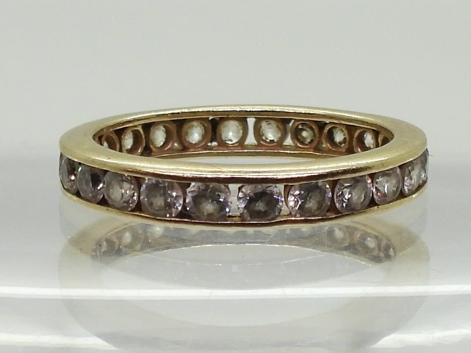 A 14k gold full eternity ring set with cubic zirconia, finger size O, weight 2.8gms Condition - Image 2 of 3