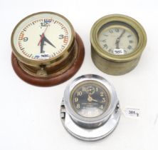 A U.S. Navy Mark I Boat Clock; a Marine Nationale bulkhead clock by J. Auricoste, Paris; and another