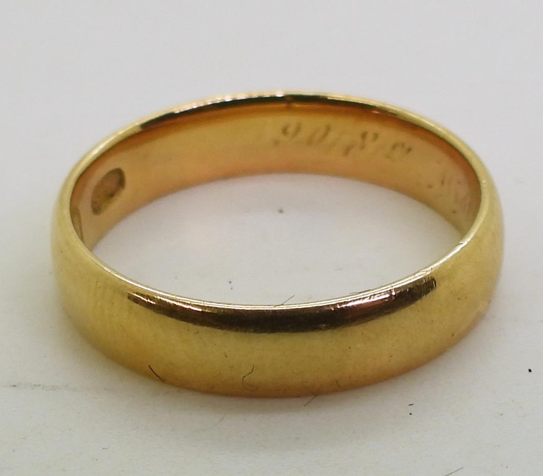 An 18ct gold wedding band with Glasgow hallmarks for 1906, finger size K1/2, weight 3.4gms Condition - Image 2 of 2