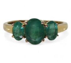 A 9ct gold emerald three stone ring, size T, weight 2.4gms Condition Report:Available upon request