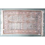 A multicoloured ground "100% silk" Kashmir rug with tree of life design within pink floral pattern