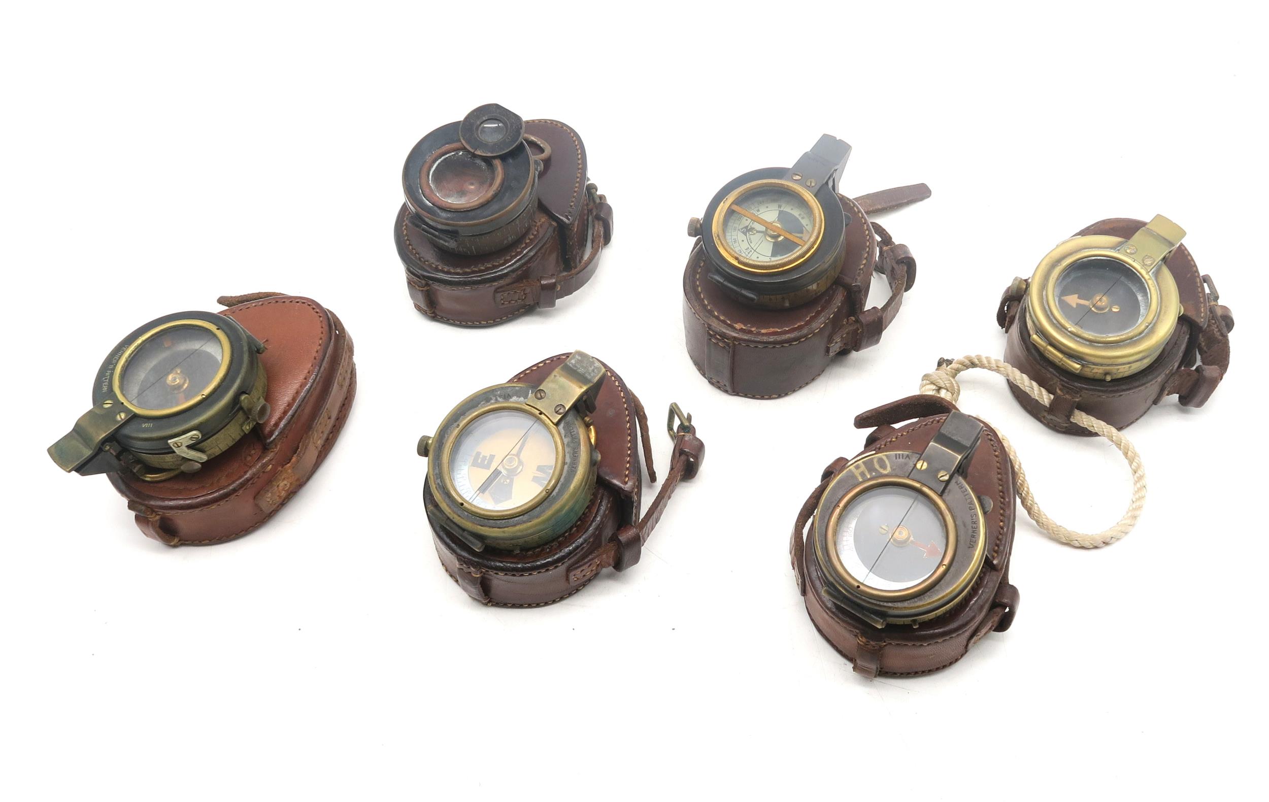 Six WW1 period leather-cased compasses; to include a 1917-dated Verners Pattern example with case