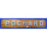A ship's name plate for the merchant vessel MV Pochard, formed of heavy cast metal letters set