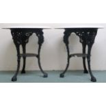 A pair of late 19th/ early 20th century pub/bar tables with painted circular tops on cast iron bases